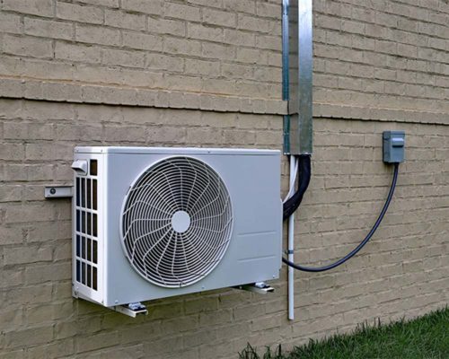 mini split hvac unit on tan brick wall oakland park fl